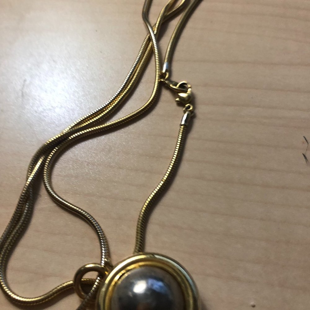 Vintage Liz Claiborne gold and silver spinning orb pendant and necklace